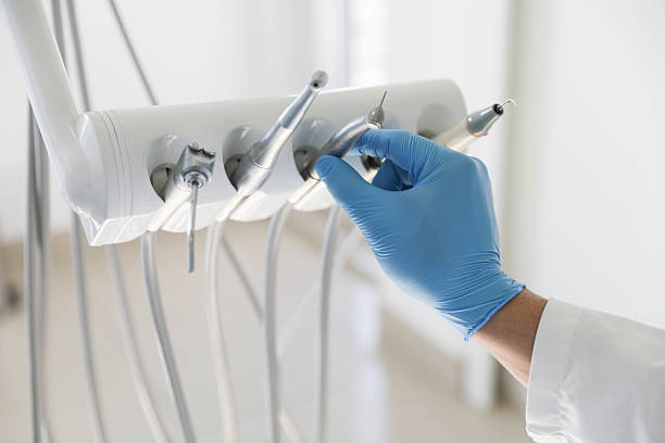 Professional Tooth Extraction technician working in Wyandotte, MI